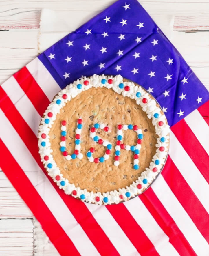 Cookie cake on an American flag with the acronym 