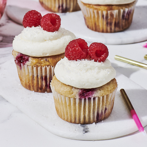 Vanilla raspberry cupcakes with coconut frosting