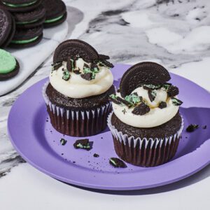 Mint sandwich cookies on chocolate cupcakes