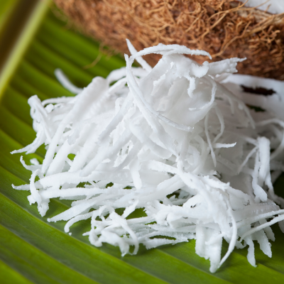 Coconut slices on a palm leaf