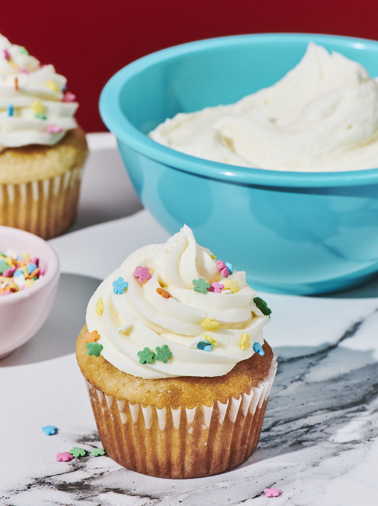 Vanilla buttercream frosting on a cupcake